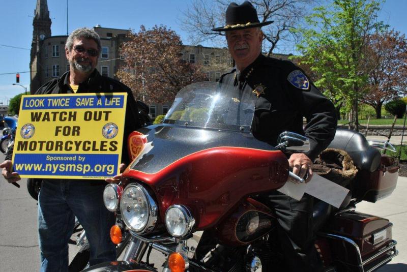 Sheriff Tim Howard and Pete Campanella take part in the annual motorcycle awareness rally  in downtown Buffalo