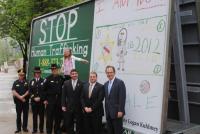 Sheriff Howard and others with Logan Kuhlmey, 10, one of 5 winners of the Human Trafficking Awareness contest