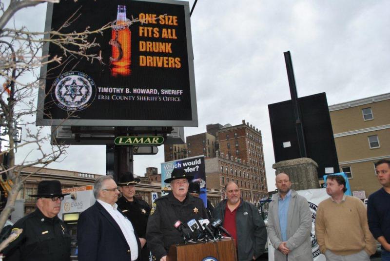 Sheriff Tim Howard, Bill Yuhnke of Liberty Cab, and some Chippewa area bar owners announce St. Patrick's Day free cab ride home.