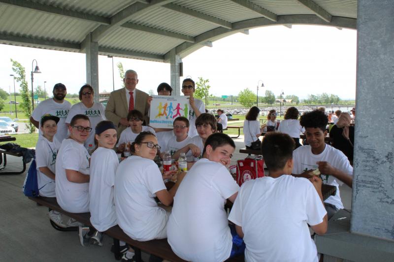 Erie County Clerk Mickey Kearns talks with students from Lackawanna Middle School during the ‘Healthy District Initiative Parks Cleanup Day!’.
