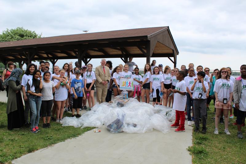 Erie County Clerk Mickey Kearns congratulates students from Buffalo PS #45 and Ken-Ton Middle School for completing their cleanup at Beaver Island State Park in Grand Island.